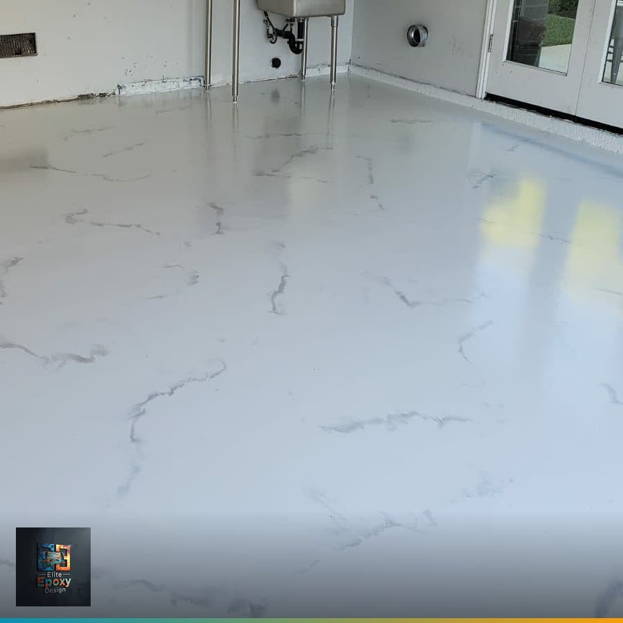 Epoxy flooring contractor consulting with a homeowner in a residential garage